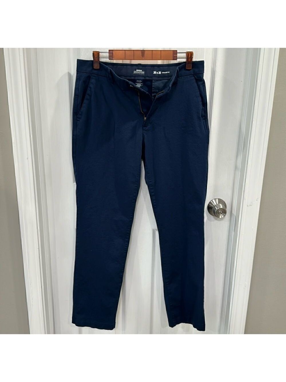 IZOD PERFORMANCE TROUSERS.